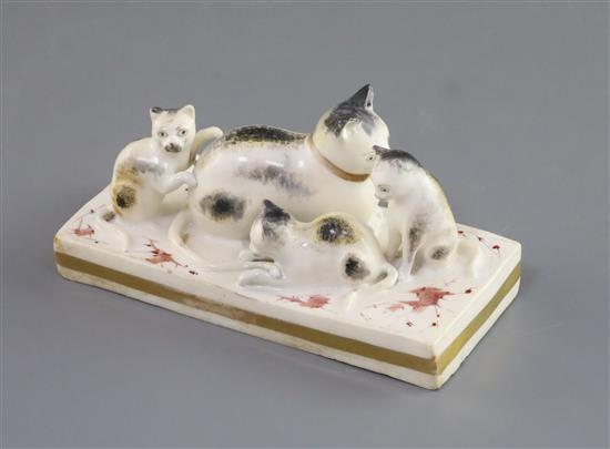 A Rockingham porcelain group of a cat and three kittens, c.1826-30, L. 10.8cm